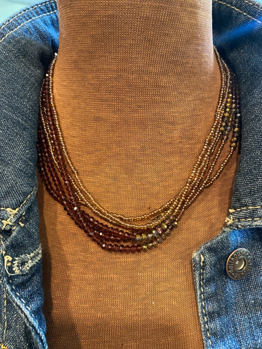 Fun garnet colored and gold crystal bead necklace. Super cool on white tee